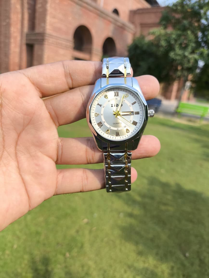 Writing      Luxury Analog Quartz Watch for Men | Silver Gold Stainless Steel Strap Wristwatch with White Dial, Roman Numeral Markers & Date Display , Elegant Fashion Watch